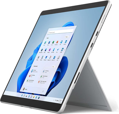 Microsoft Surface Pro 9 laptop with 13-inch touchscreen, silver finish, keyboard, Core i7 processor, 16GB RAM, and 512GB SSD.